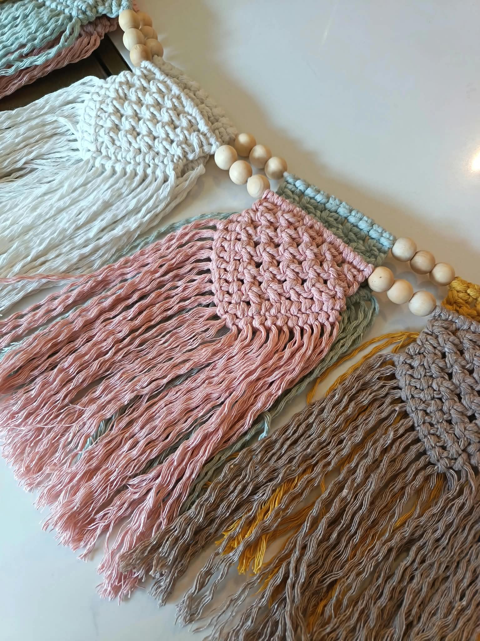 Handmade macramé wall hangings in Craftalo colours